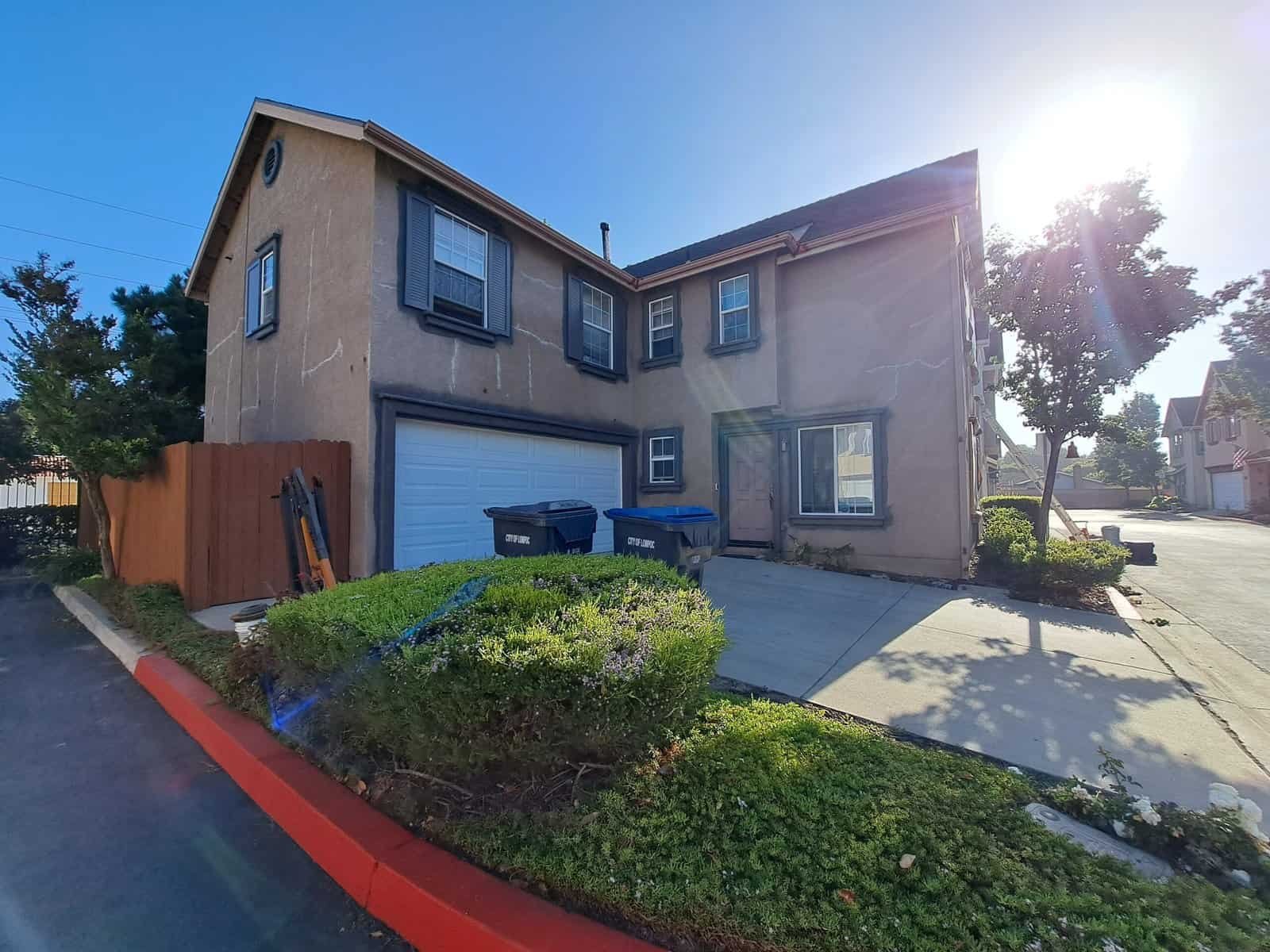 Freshly painted residential house exterior by CA TOP PAINTING in California. Expert house painting and remodeling services.